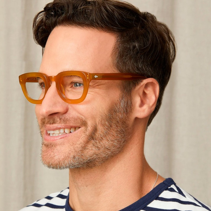 Model wears Moscot Telena Butterscotch