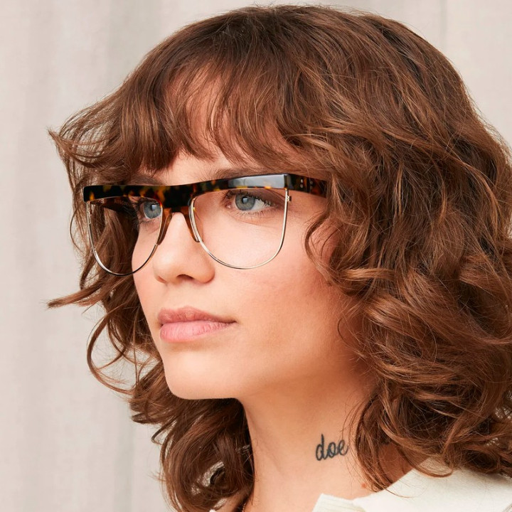Model wears Moscot Shonda Blonde Tortoise 3q view