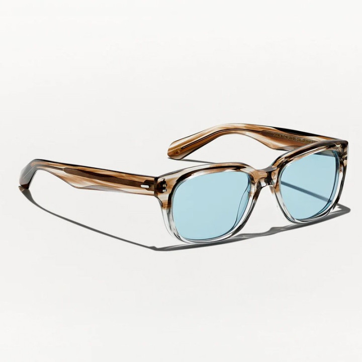 Las Zindik Sun en Brown Smoke con lentes minerales azules vista 3q